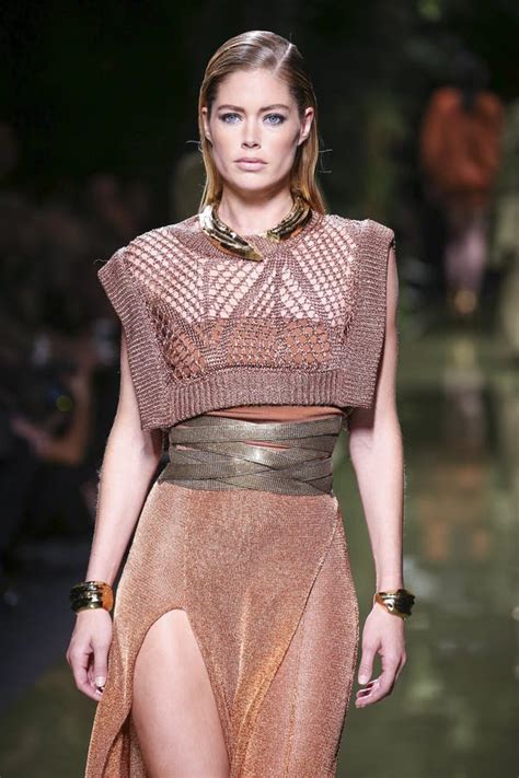 Doutzen Kroes walks the runway at the Versace show during .